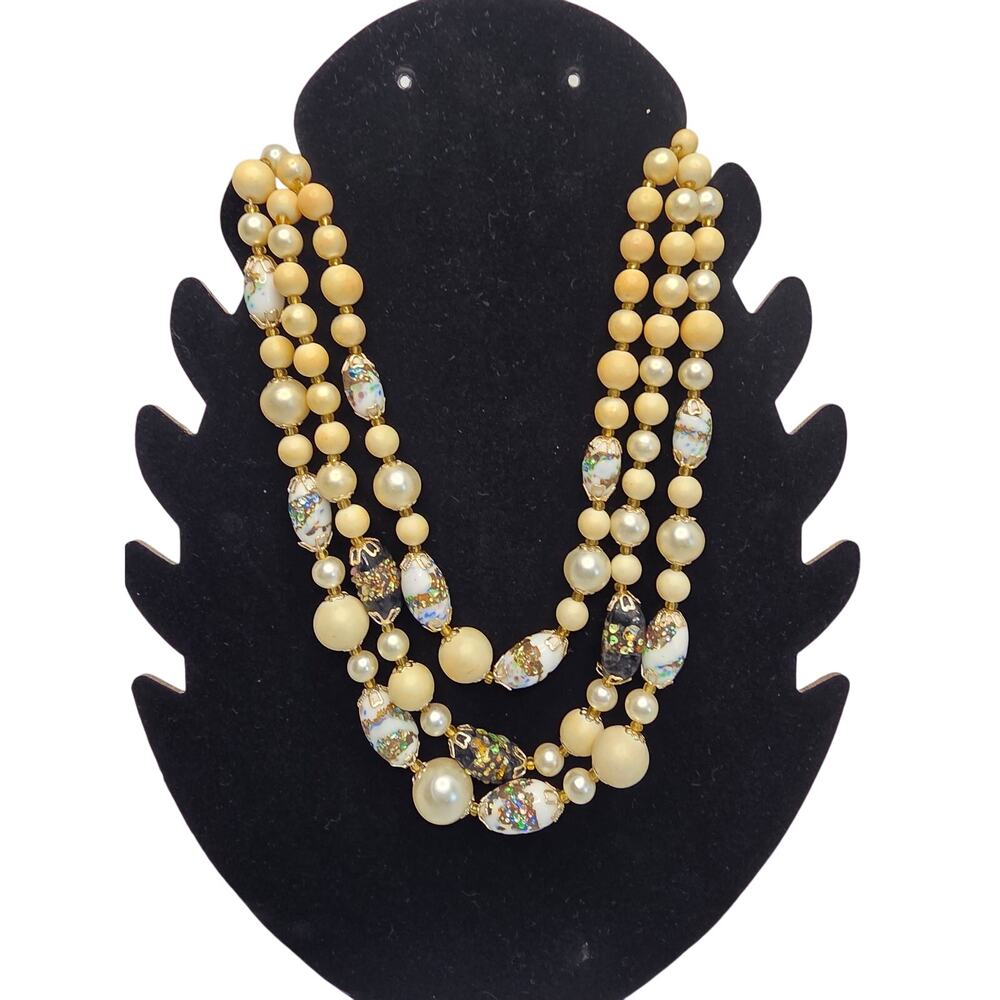 Vintage necklace with decorative and cream beads